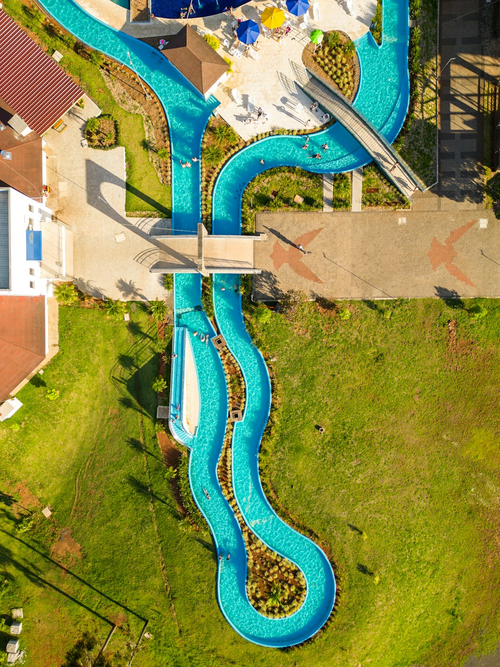 an aerial view of a pool with a slide