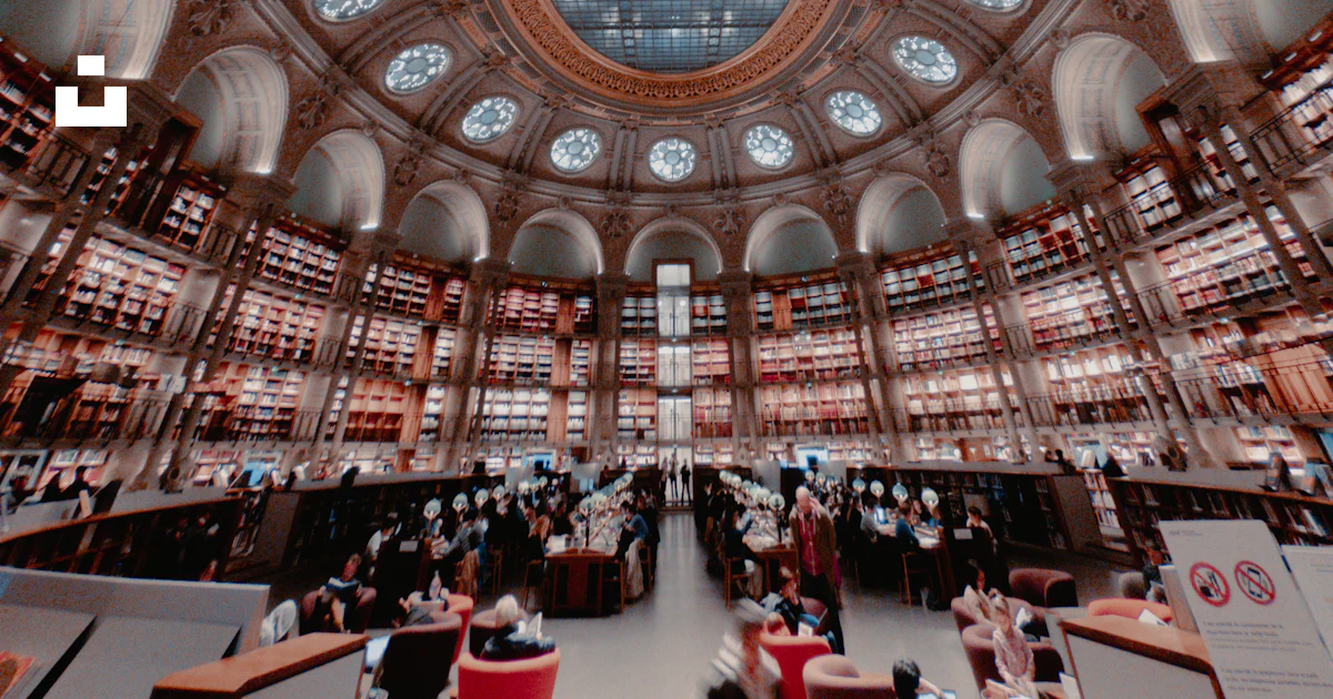 The ceiling of a large library with many tables and chairs photo – Free ...