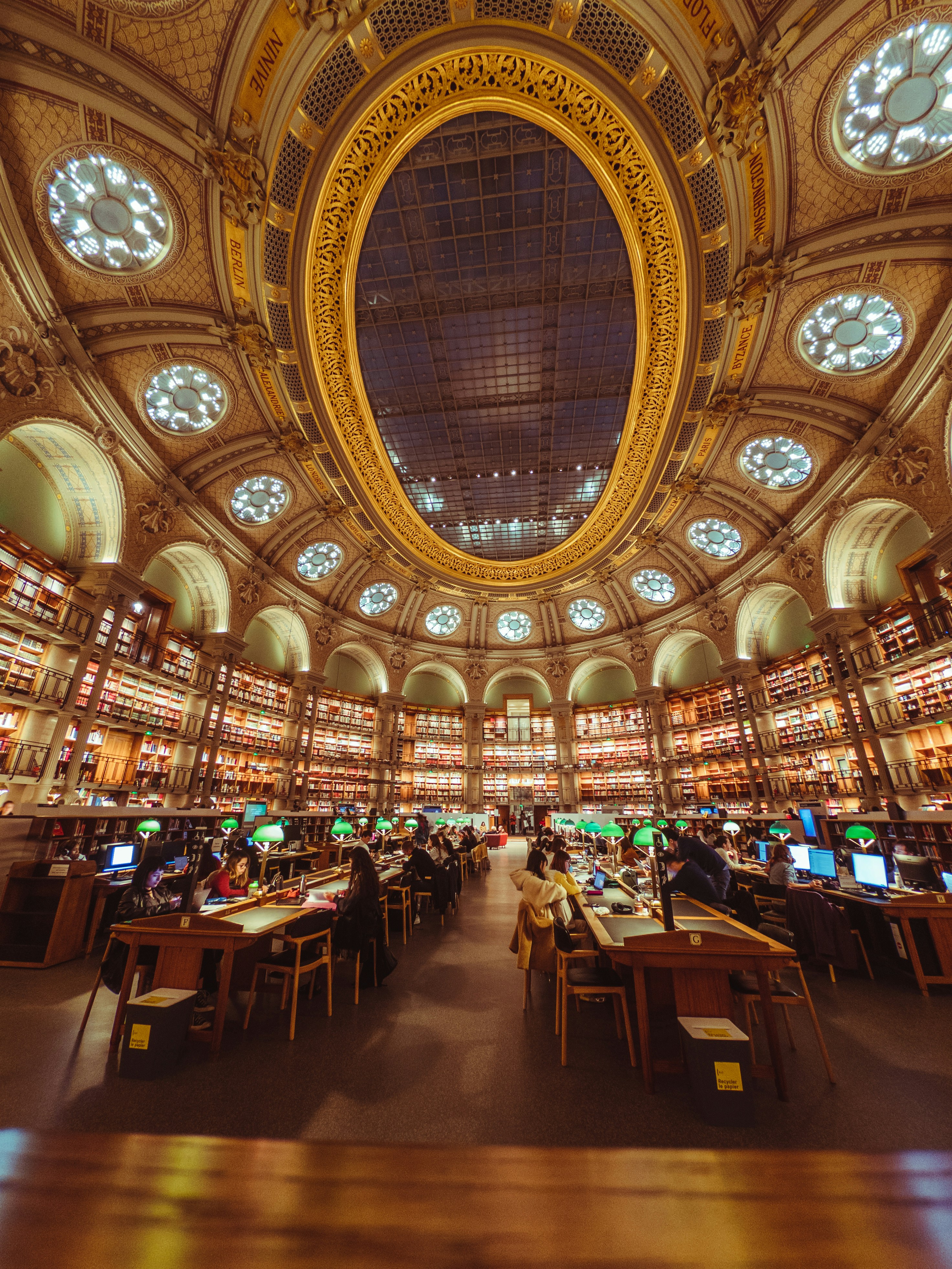 A library filled with lots of books and lots of windows photo – Free ...