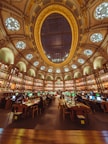 a library filled with lots of books and lots of windows