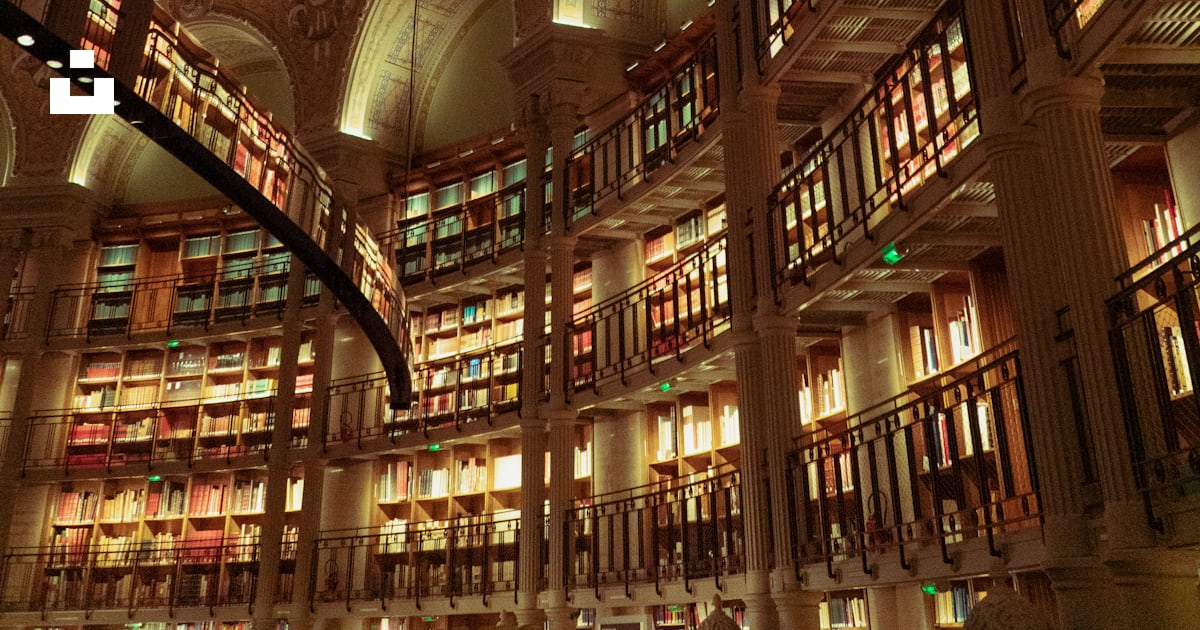 A large library filled with lots of books photo – Free Paris Image on ...