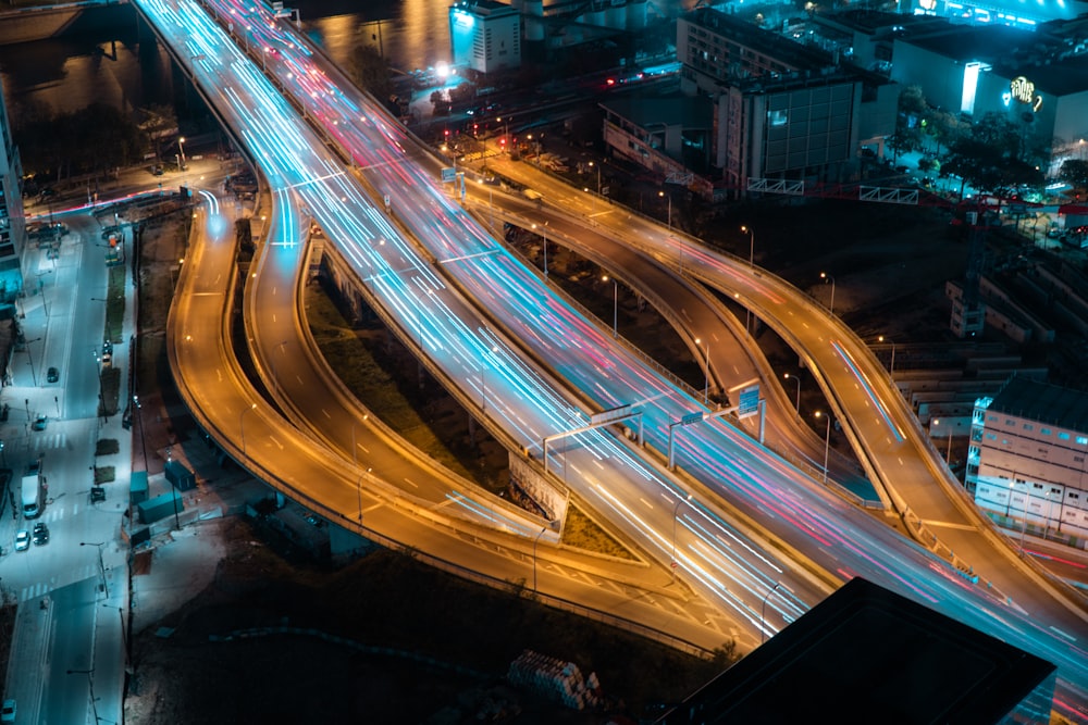 an aerial view of a highway intersection at night