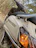 Close-up of a limited edition electric scooter with unique camouflage paint in a forest setting.