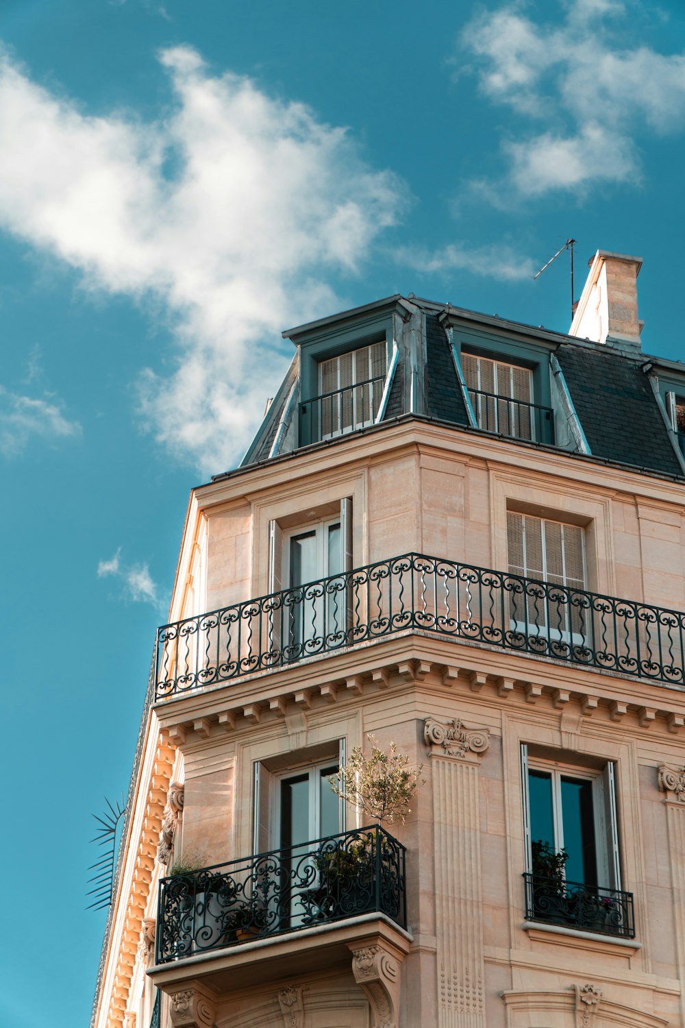 a tall building with a balcony and balconies