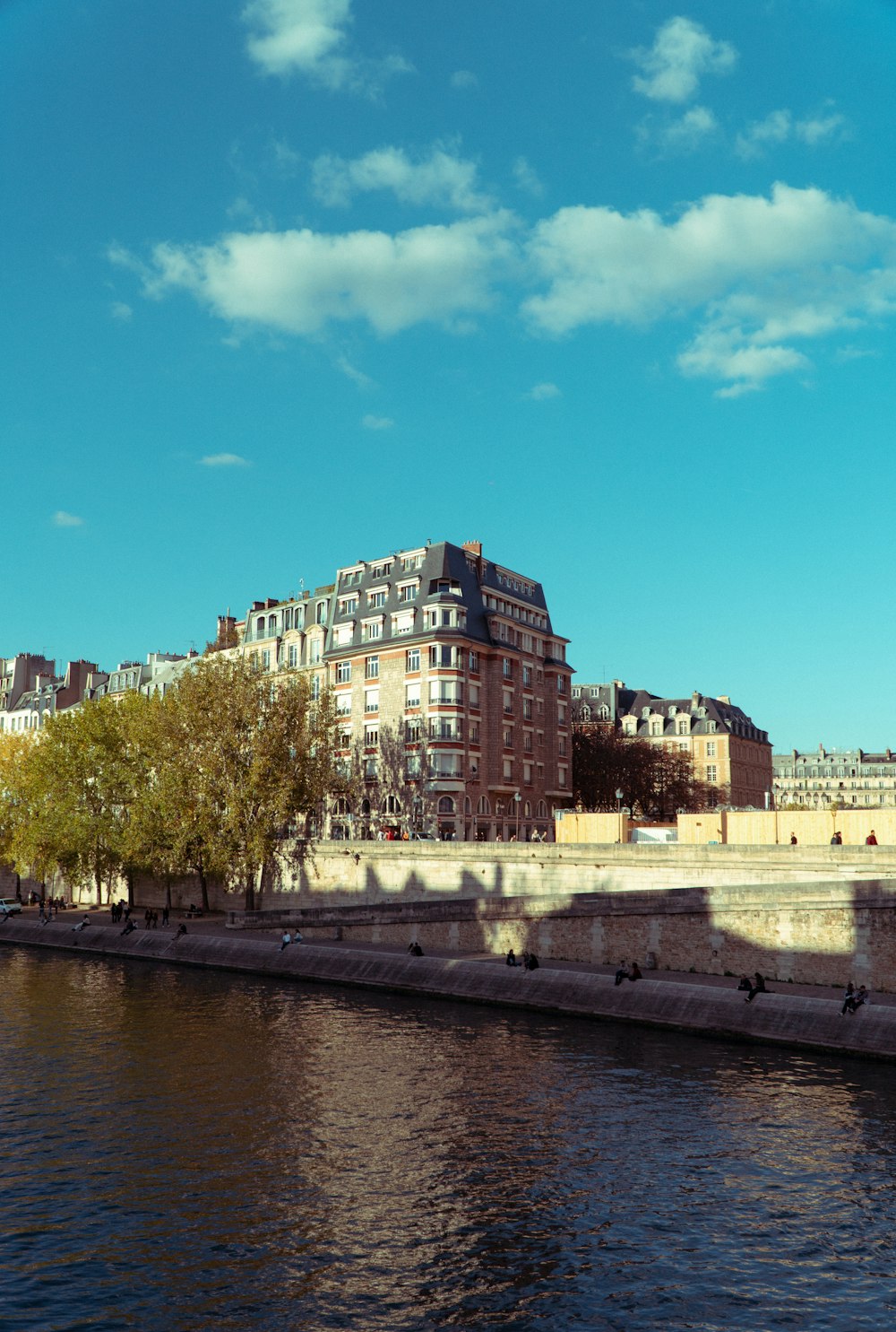 a body of water with buildings on the side of it