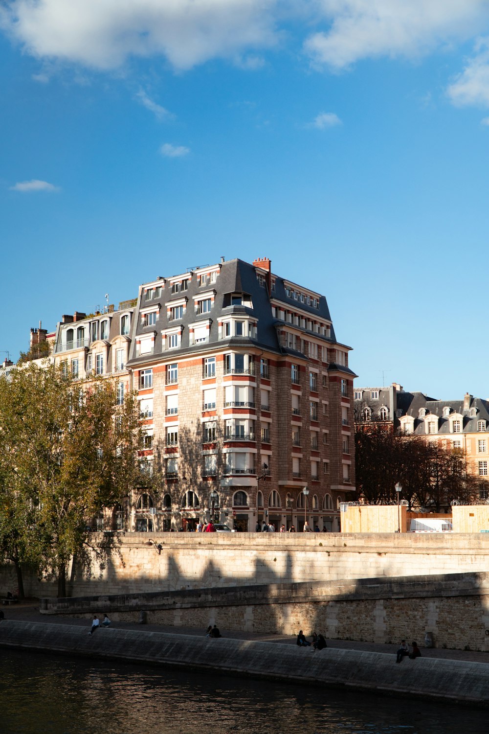 a large building next to a body of water