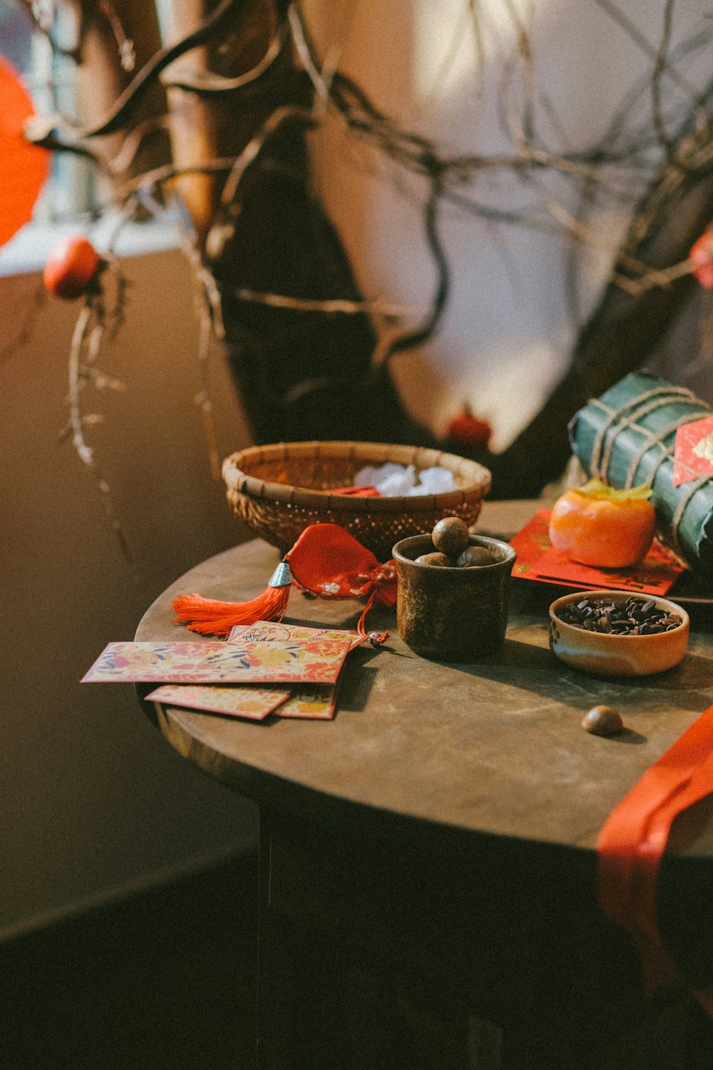 a wooden table topped with a bowl of fruit