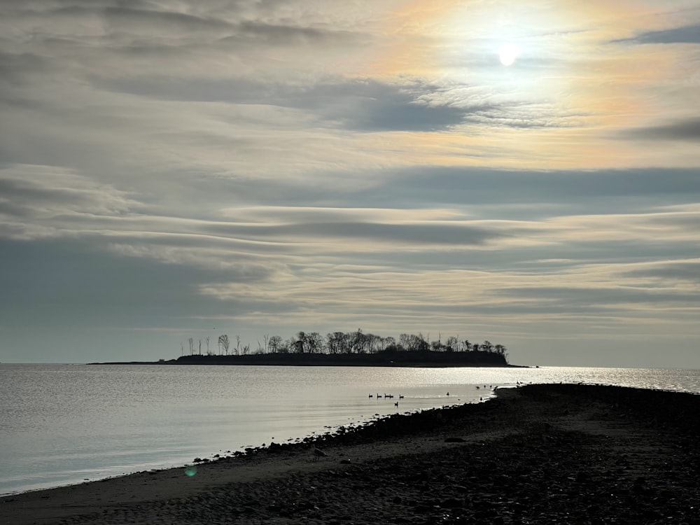 a body of water with a small island in the distance