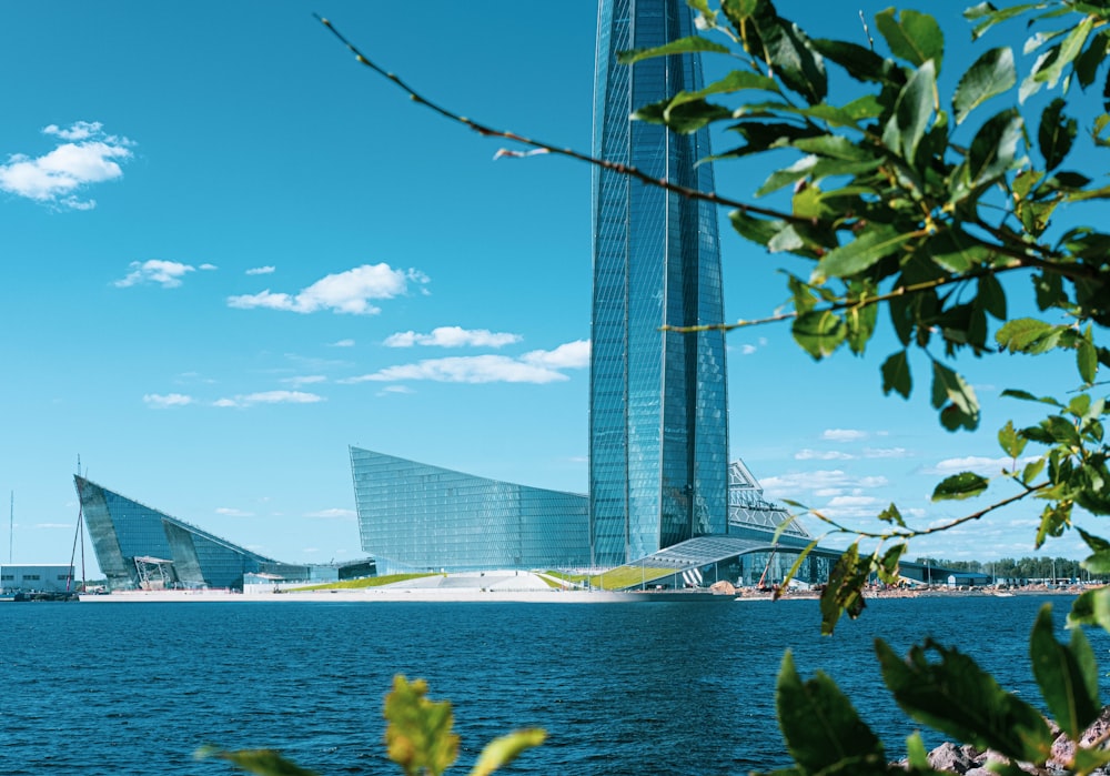 a tall building sitting on top of a body of water