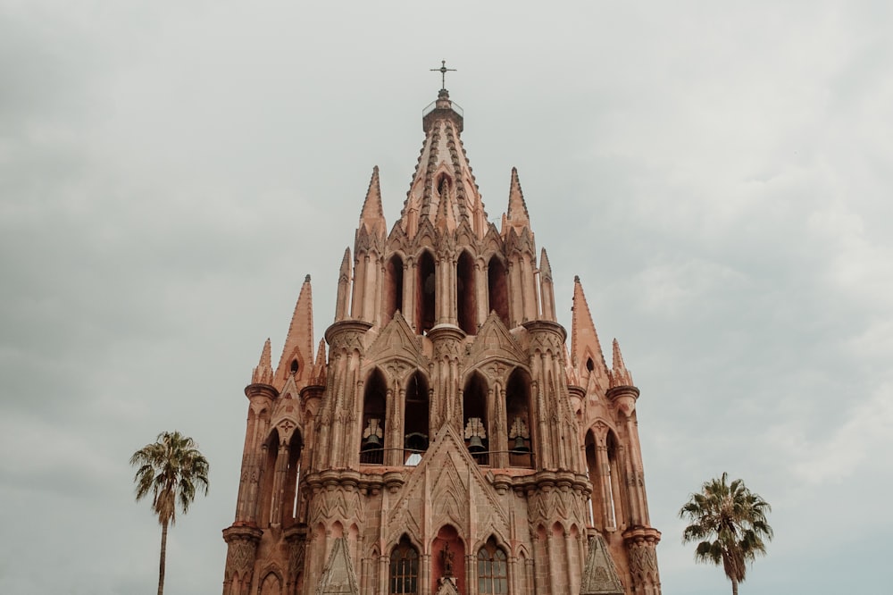 a very tall building with a cross on top of it