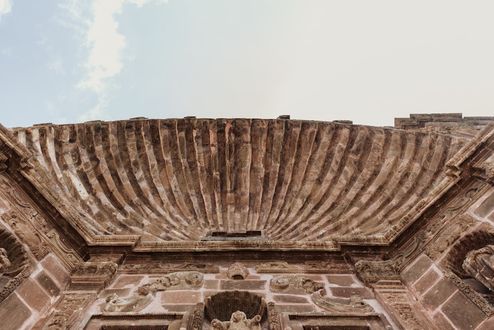 a close up of a building with a sky in the background