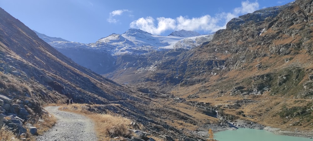 a view of a mountain range with a river in the foreground