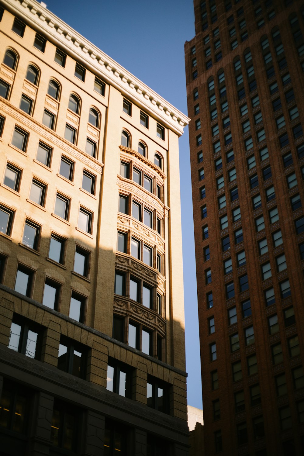 a tall building next to another tall building