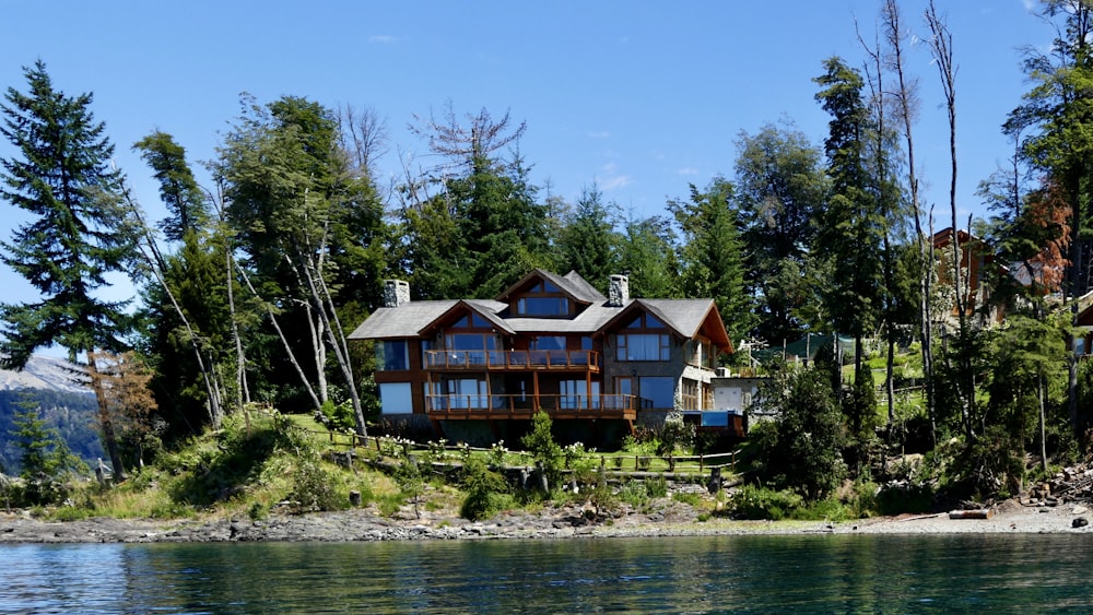 a house sitting on top of a lush green hillside