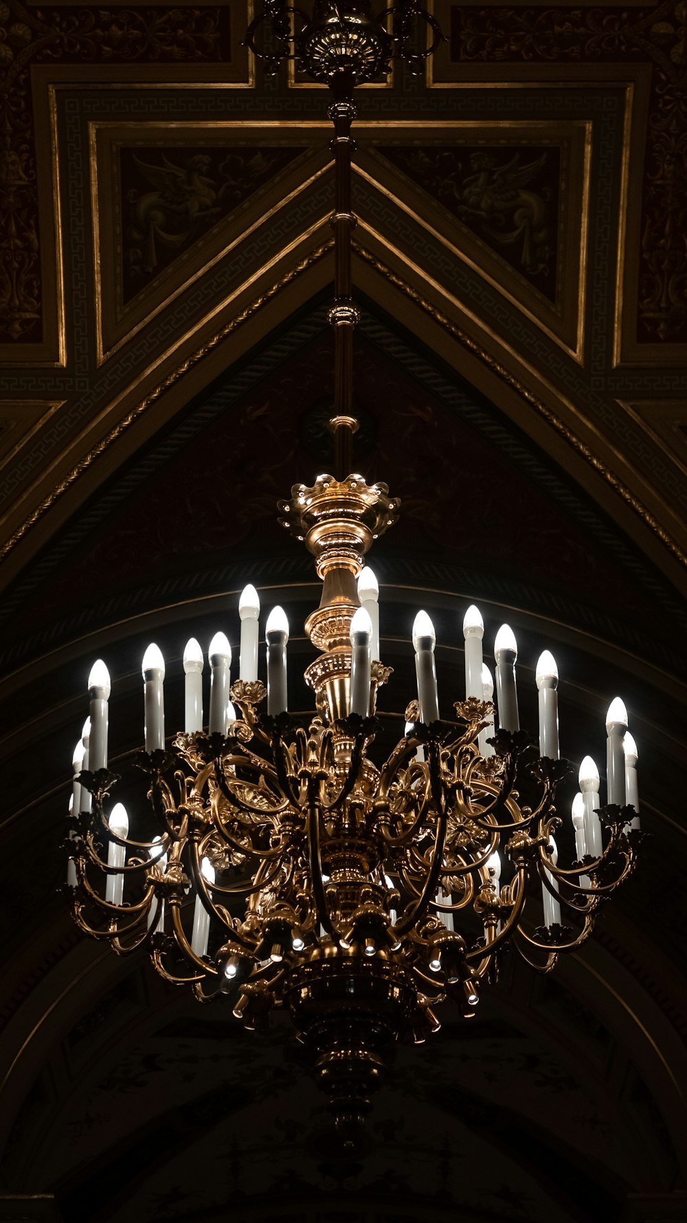 a chandelier hanging from the ceiling of a church