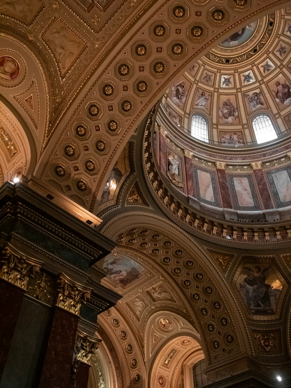 the ceiling of a large building with a dome