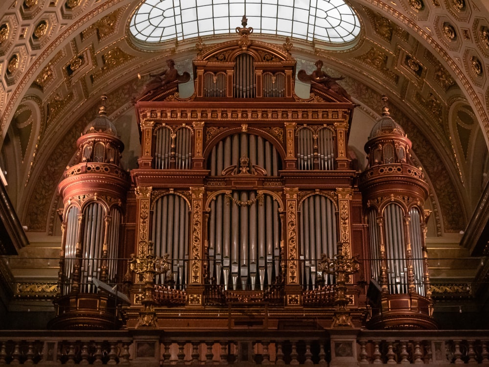 a large pipe organ in a church with a skylight