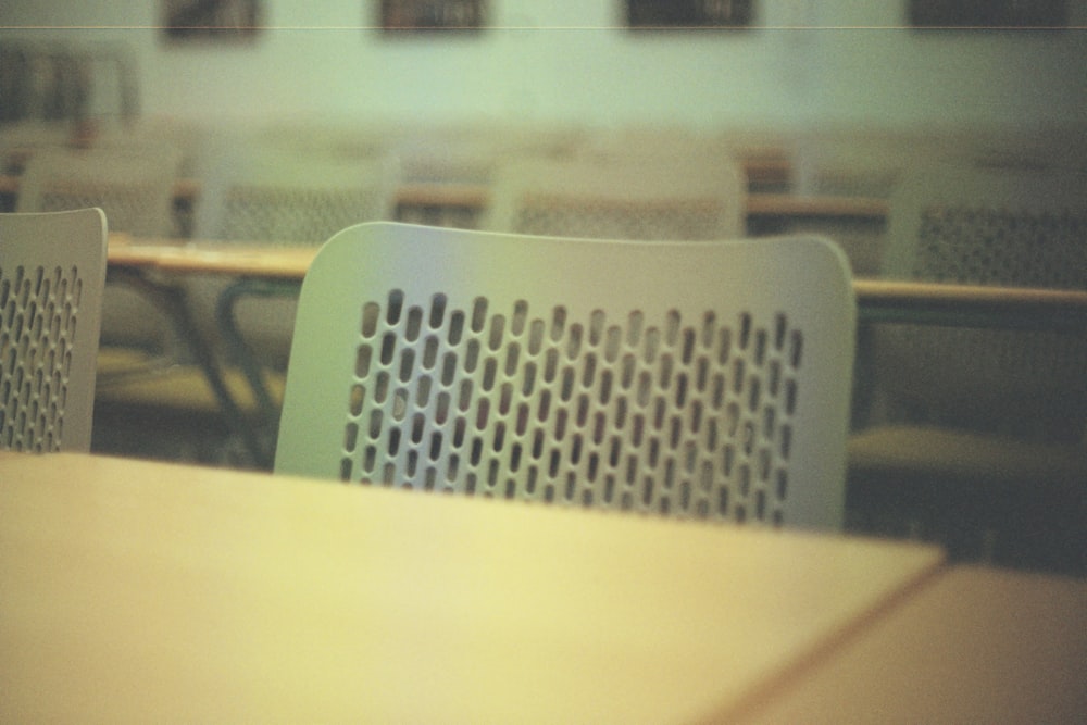 a table with a bunch of chairs around it