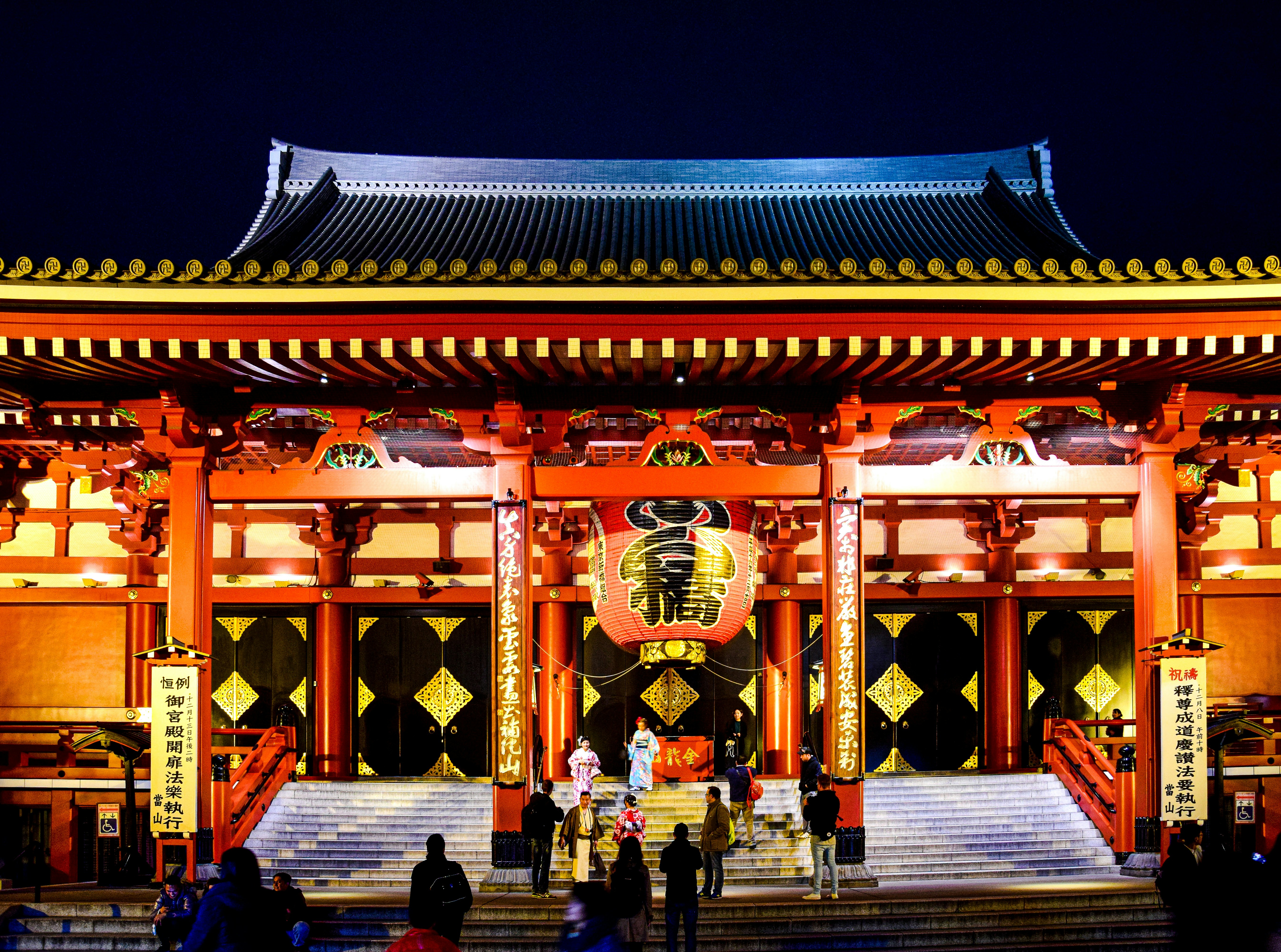 A group of people standing in front of a building