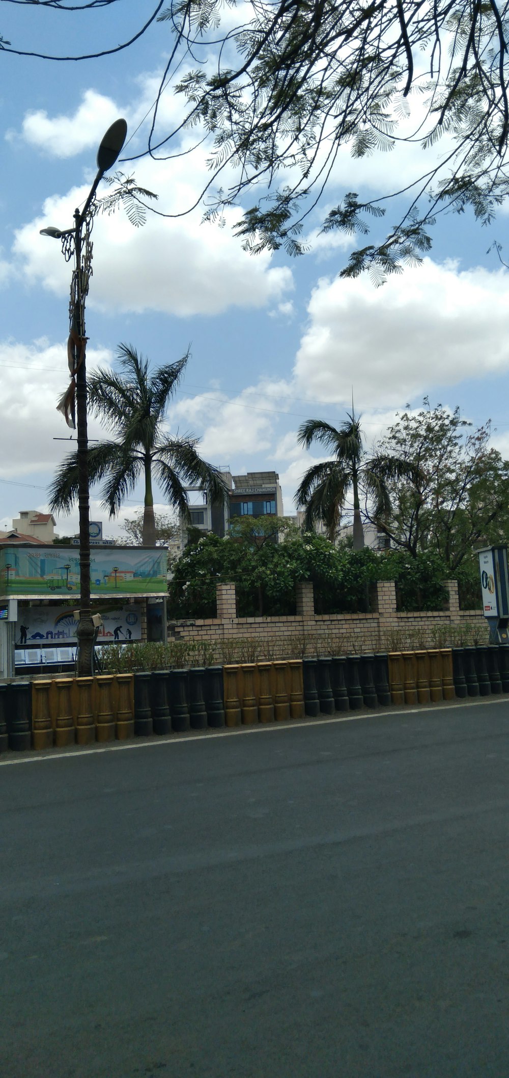 a street light with a building in the background