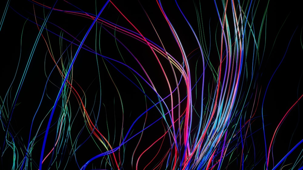 a black background with a bunch of colorful lines