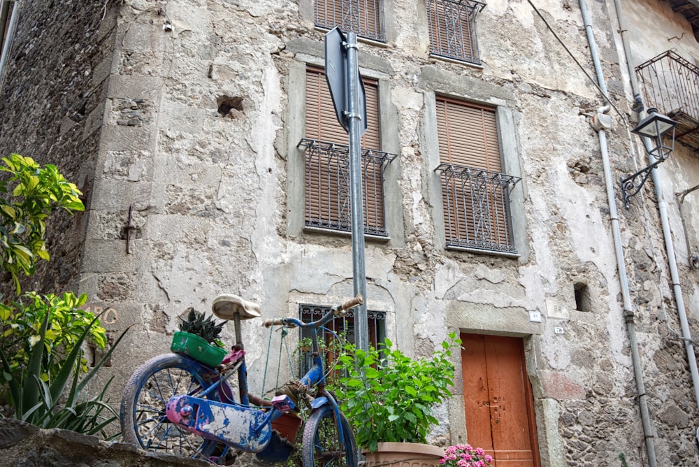 a bicycle parked in front of an old building