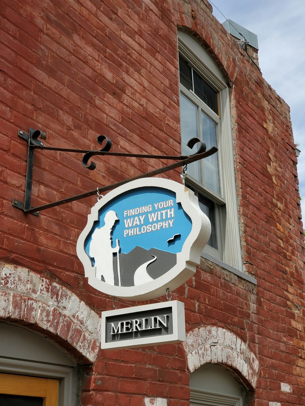 a brick building with a sign on the front of it