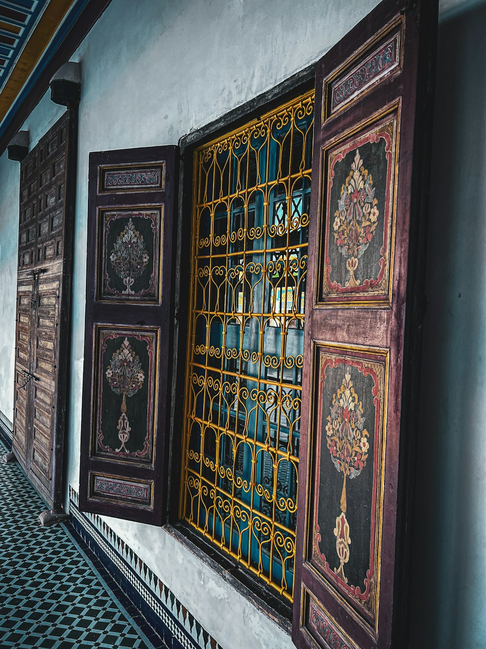 a row of windows with ornate designs on them