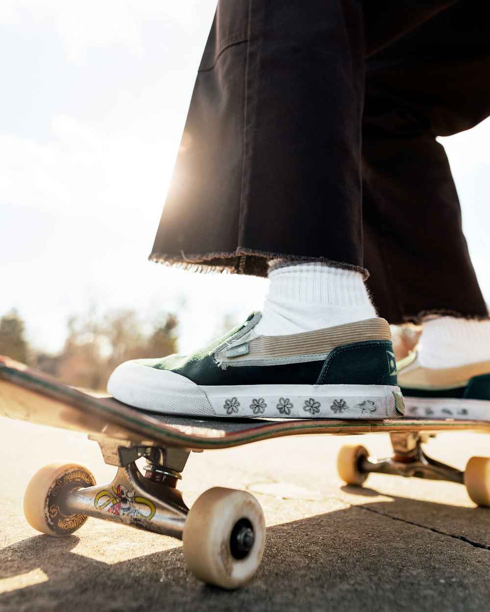 a person riding a skateboard down a street