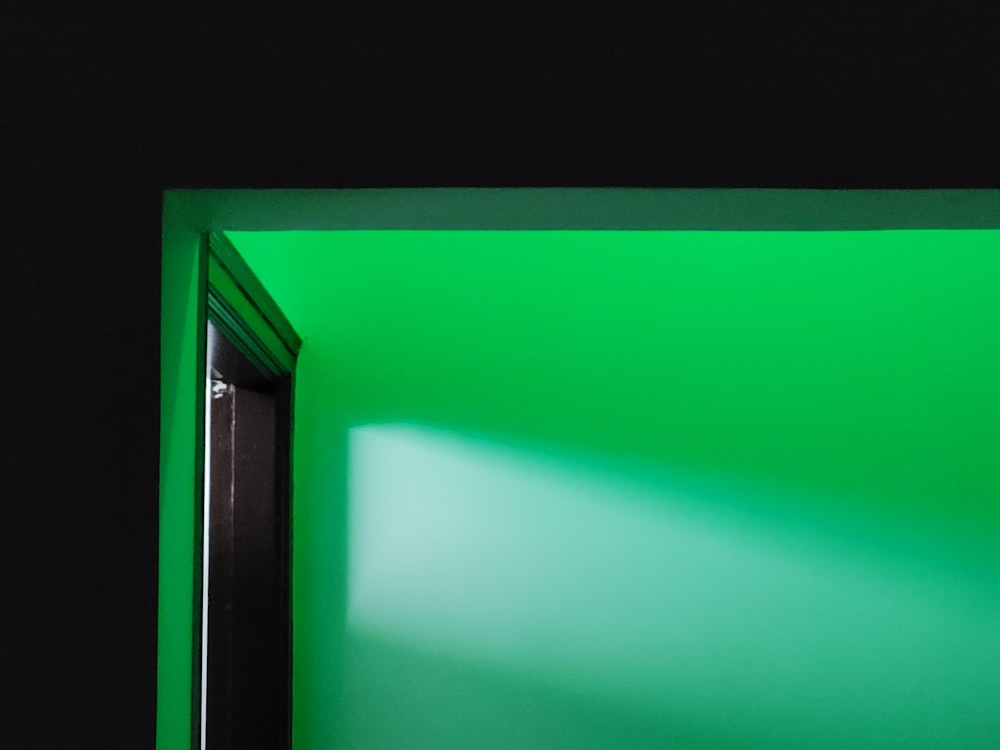 a room with a green wall and a door