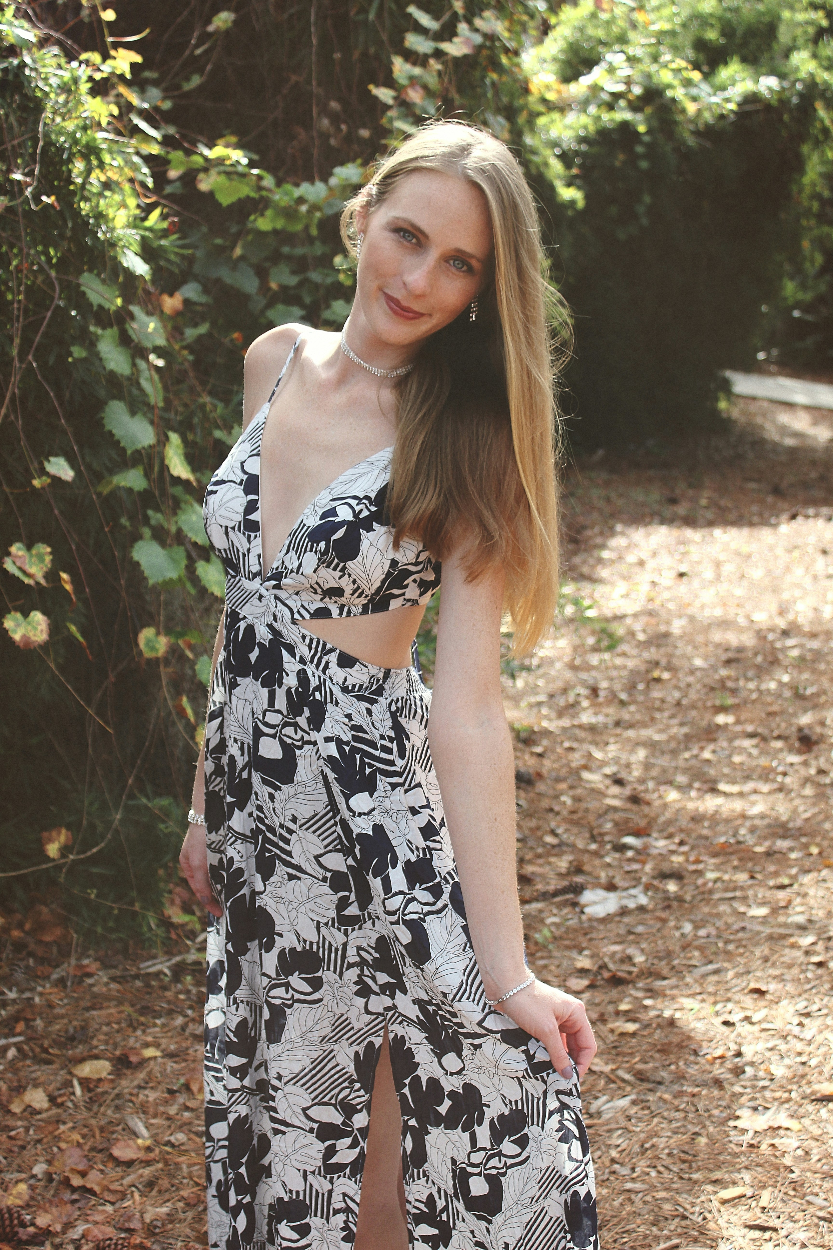 A woman in a dress posing for a picture photo – Free Dress fashion ...
