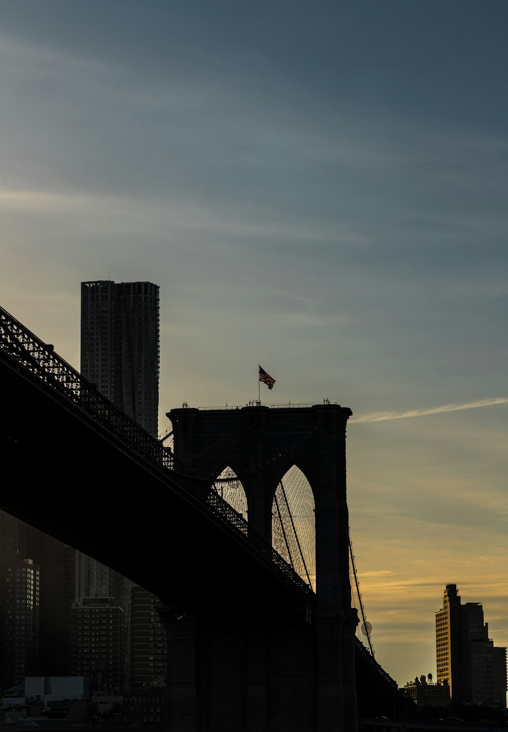 a view of a bridge with a flag on top of it