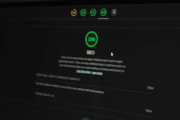 A dark-themed web interface displays an SEO performance score of 100. Multiple indicators at the top show different scores in circular icons. Text below explains the significance of the SEO score and offers additional actions to improve website optimization. A cursor is partially visible.