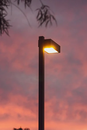 A vibrant community in northwest Cameroon illuminated by solar-powered streetlights at dusk.