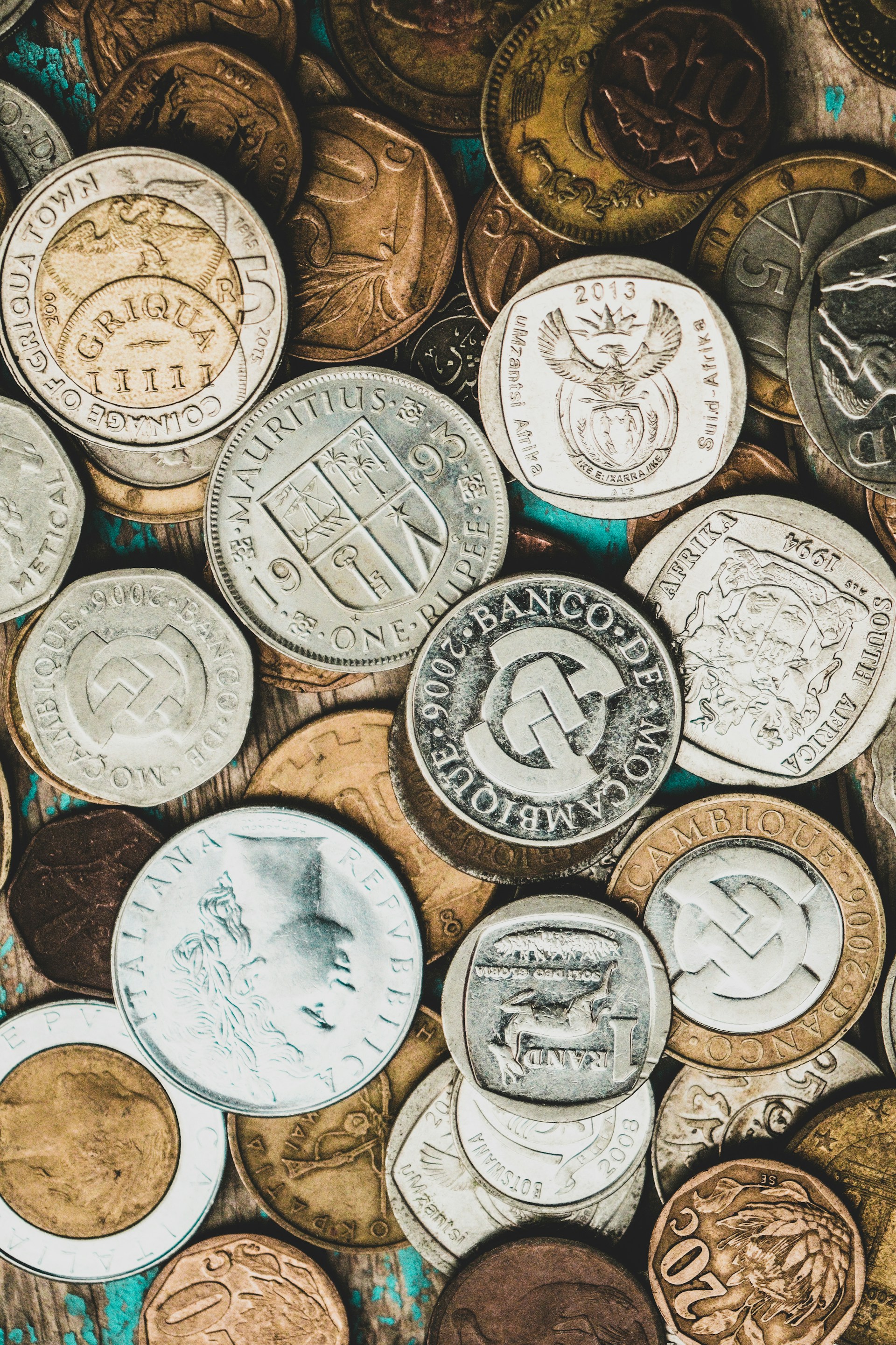 a pile of different types of coins