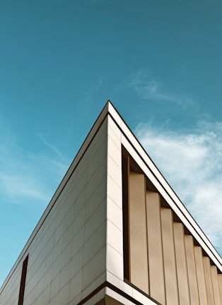 a tall building with a blue sky in the background