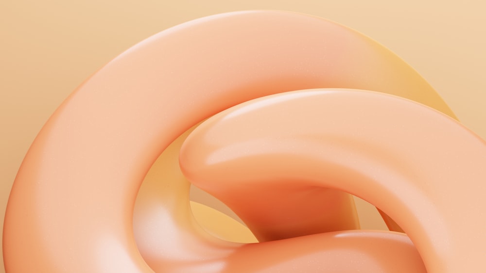 a close up of a pink object on a yellow background