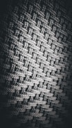 a black and white photo of a woven material