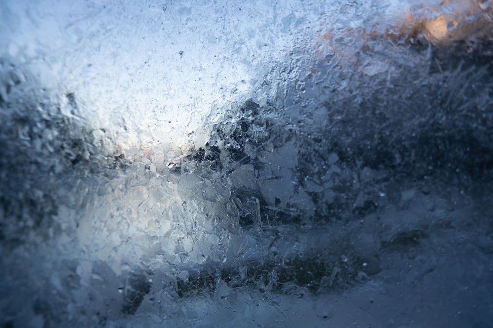 a close up of a window with water on it