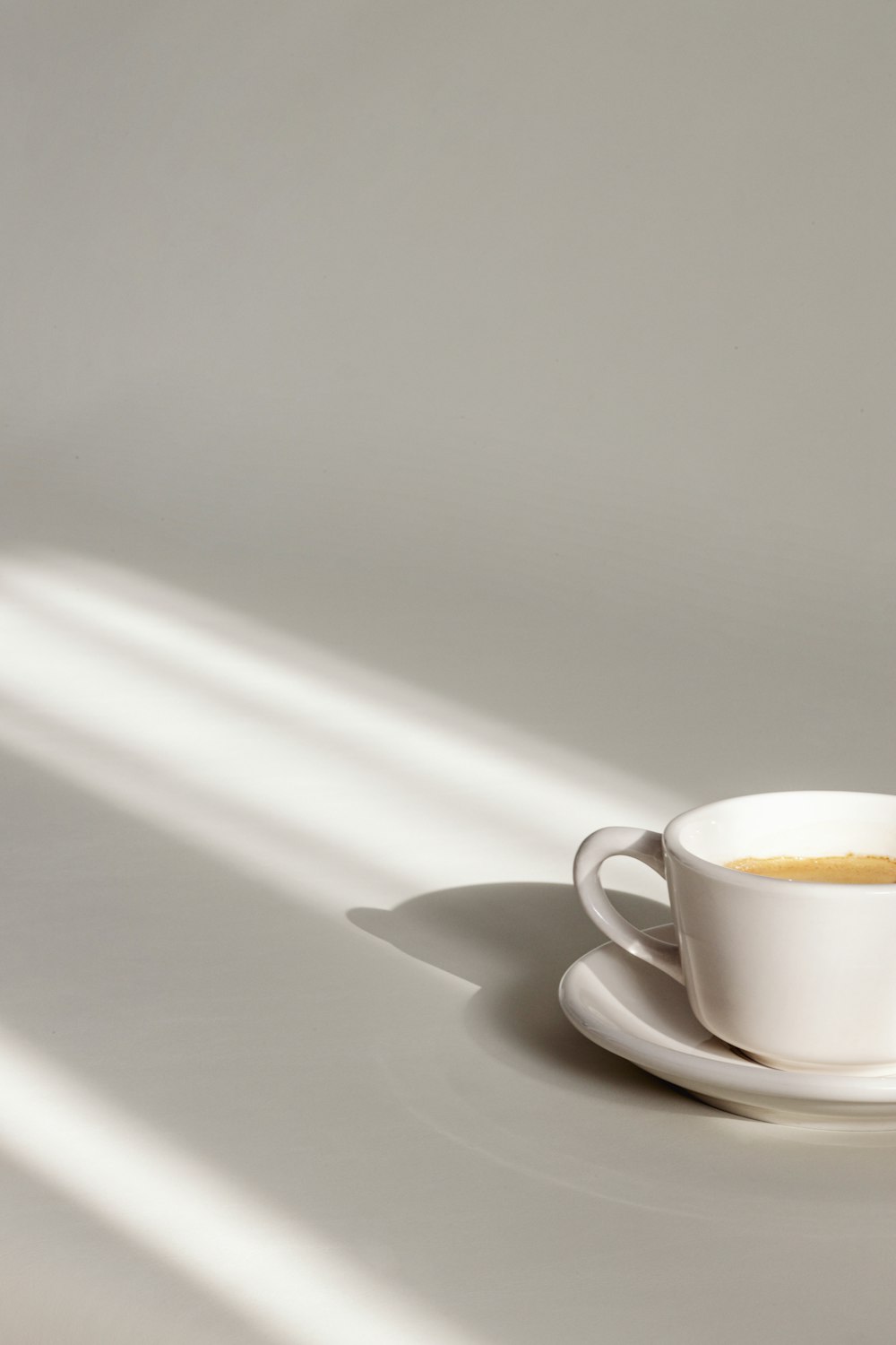 a cup of coffee sitting on top of a saucer