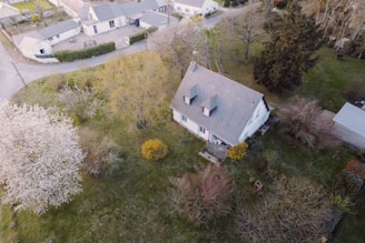 an aerial view of a house in a neighborhood