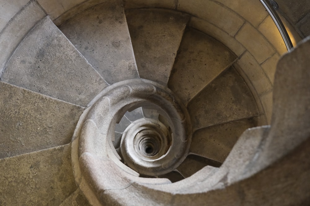 a spiral staircase in a stone building
