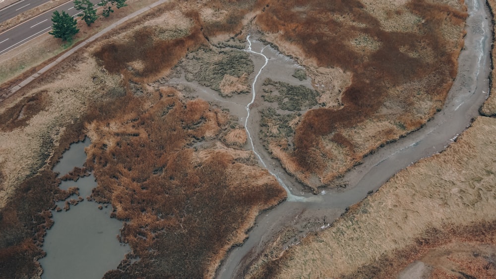 an aerial view of a winding road in the middle of nowhere