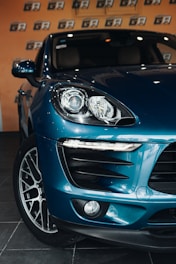 a blue sports car parked in a garage