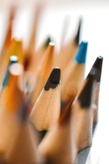 A close-up of decorative pencils and art supplies.