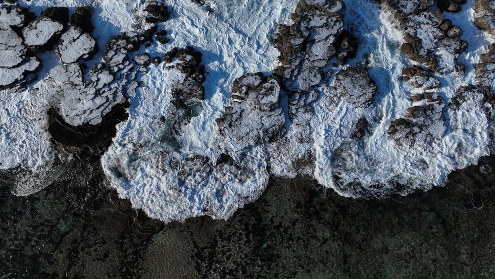 a bird's eye view of some rocks and water