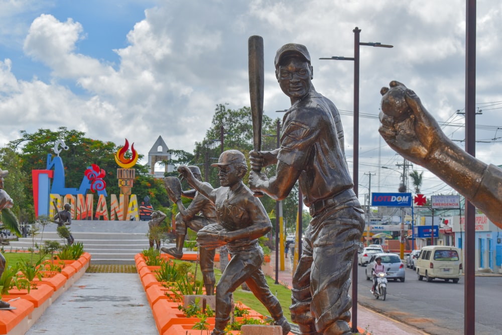 a statue of a baseball player holding a bat