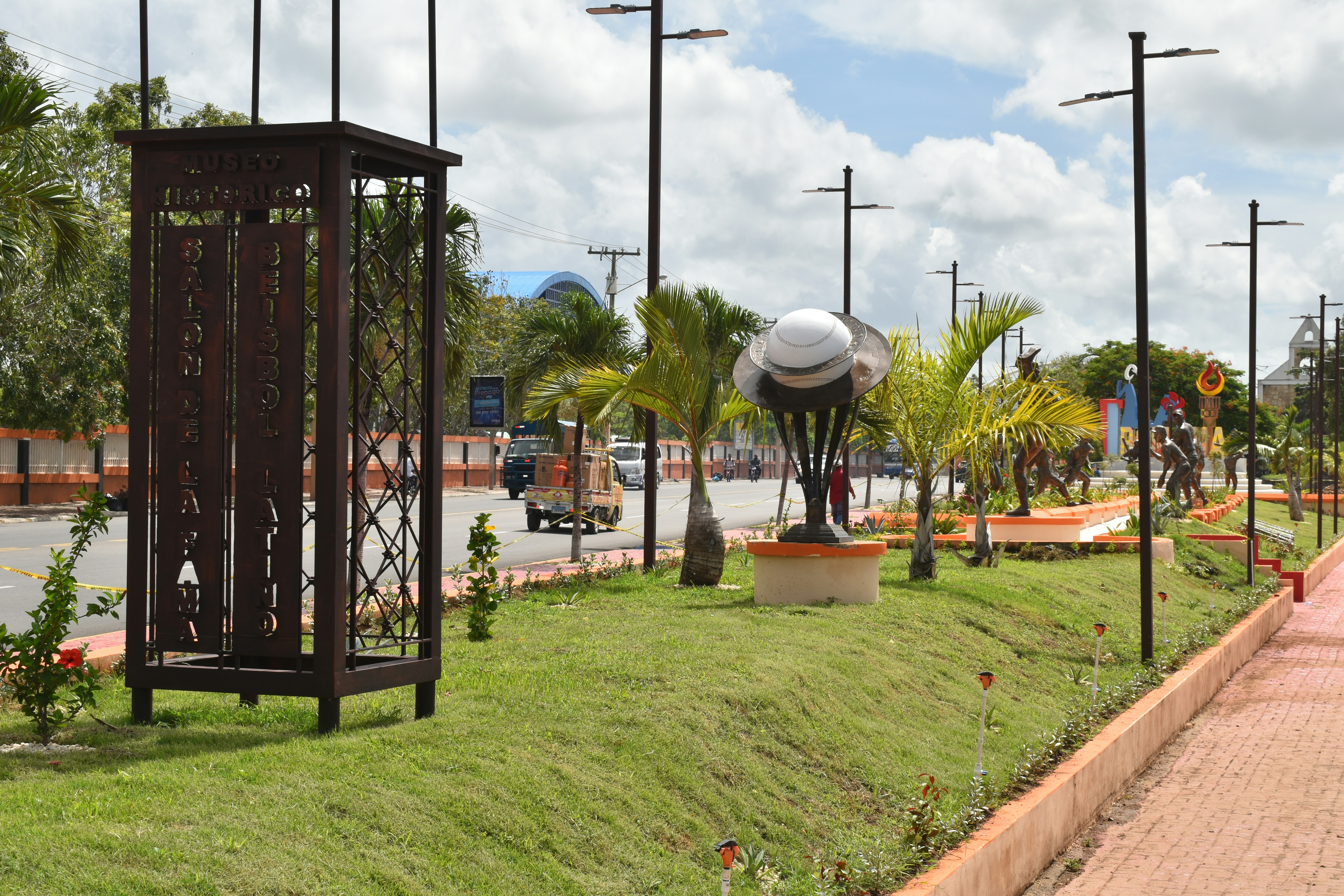 a clock tower sitting on the side of a road