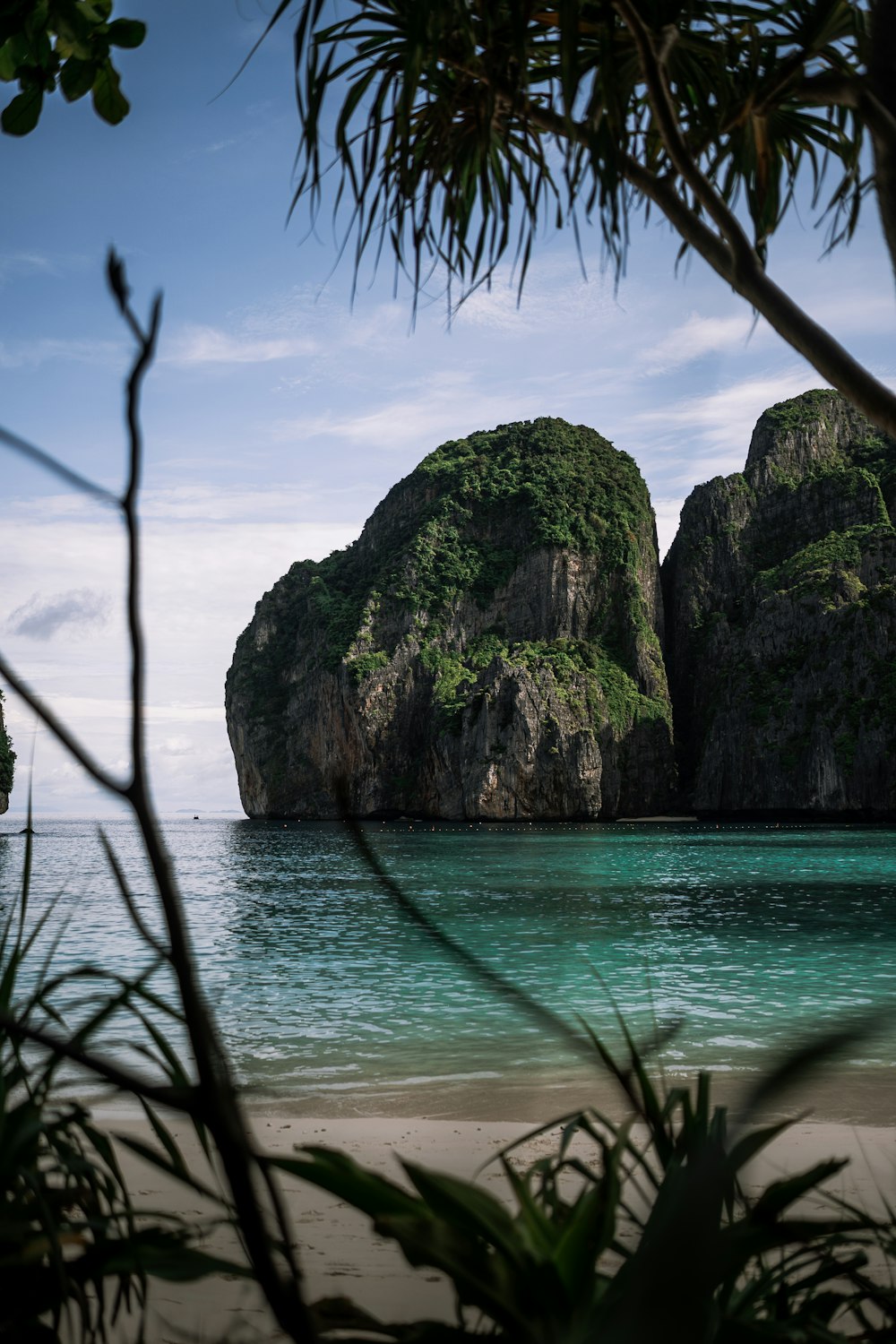 a couple of large rocks sitting in the middle of a body of water