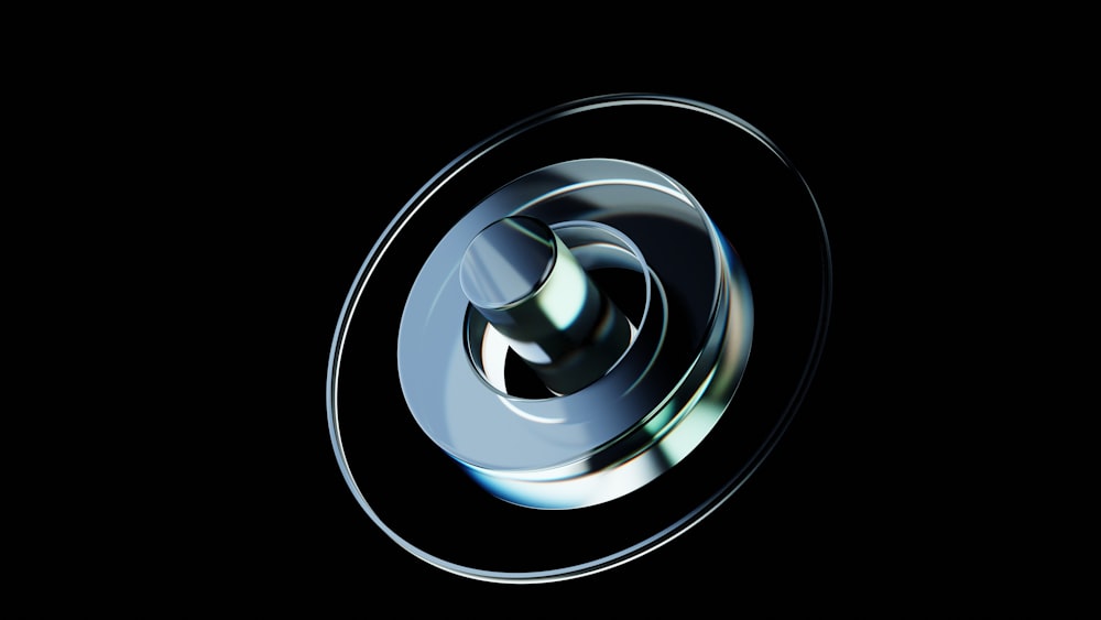 a circular metal object with a black background